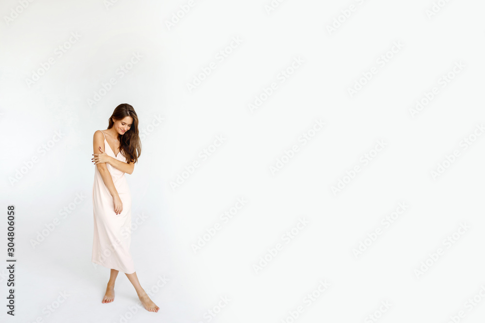 Full body young slim brunette woman on white background in studio Full body young slim brunette woman on white background in studio