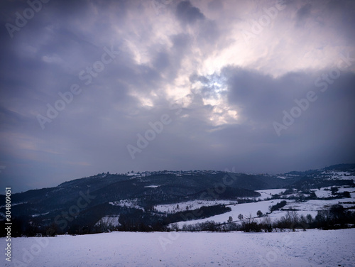 Soft focus dreamy winter landscape. Mountains and land covered in snow, Pieria, Greece.