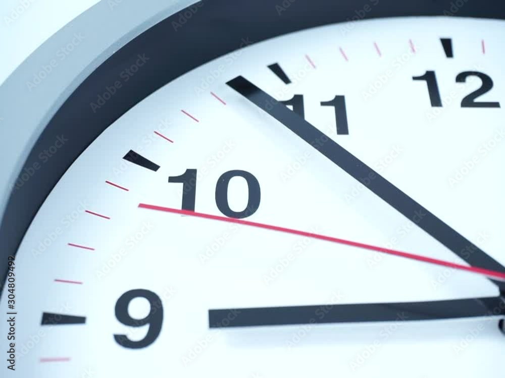 Closeup White wall clock face beginning of time 09.54 am or pm, Clock minute walk slowly, Time concept. Closeup White wall clock face beginning of time 09.54 am or pm, Clock minute walk slowly, Time concept.
