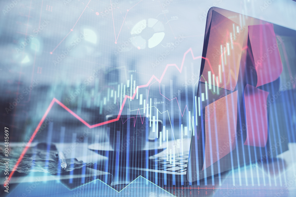Forex market chart hologram and personal computer background. Double exposure. Concept of investment. Forex market chart hologram and personal computer background. Double exposure. Concept of investment.