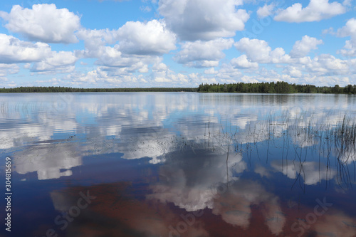 Reflection of clouds and blue Sky in Lake Ranuanjarvi in Finland