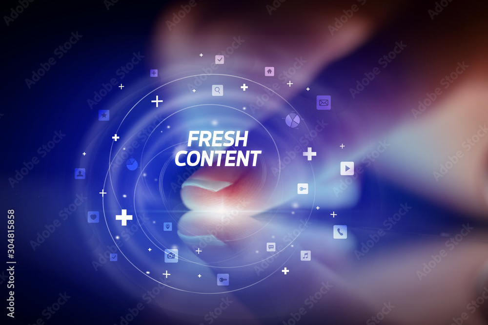 Finger touching tablet with social media icons and FRESH CONTENT Finger touching tablet with social media icons and FRESH CONTENT