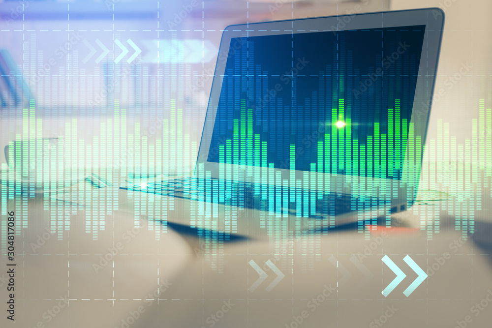 Forex market chart hologram and personal computer background. Double exposure. Concept of investment. Forex market chart hologram and personal computer background. Double exposure. Concept of investment.