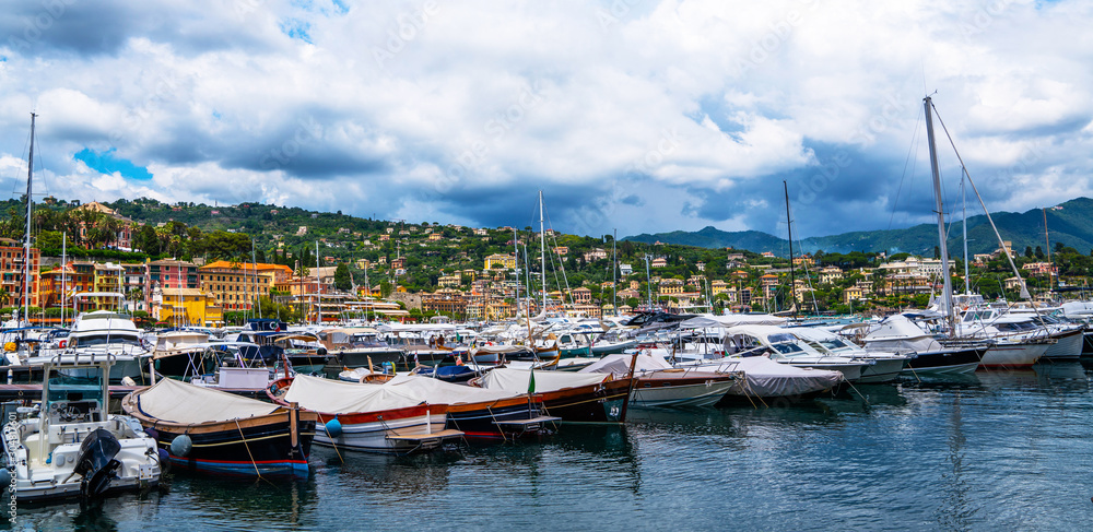 Boats near the marina of Santa Margherita Ligure, which is popular tourist destination. Santa Margherita Ligure town in summer. View from the bay. Liguria, Italy