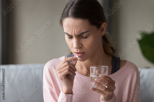 Photos Unwell young woman consider having prescribed medication