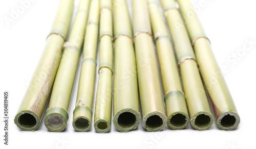 Green bamboo sticks isolated on white background  side view