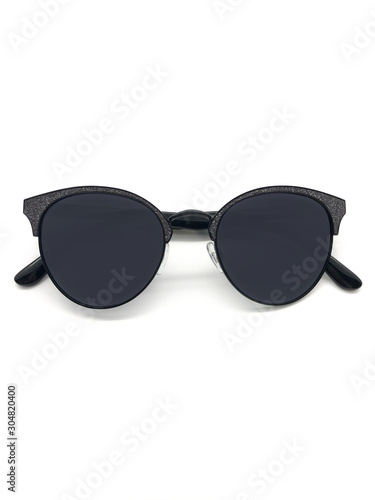 Round Cat Eye Sunglasses. Female sunglasses isolated on a white background. Glasses with a glamorous spraying. 