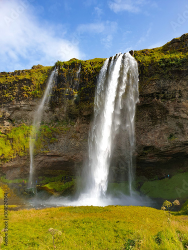 waterfall in autumn landscape in Iceland 