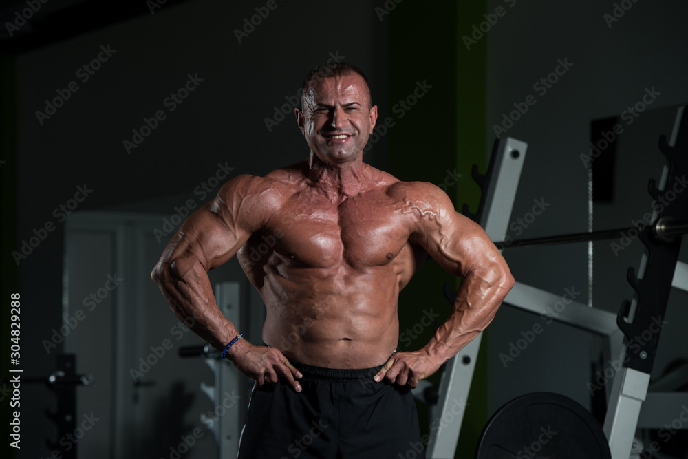 Mature Man Flexing Muscles