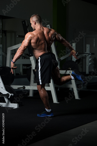 Mature Bodybuilder Flexing Muscles