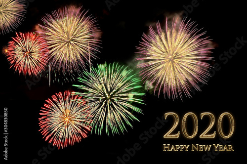 New year 2020 greeting card with gold letters and fireworks