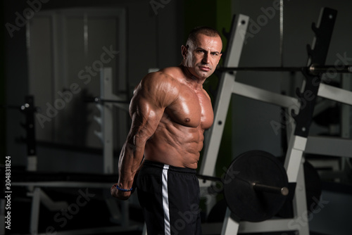 Mature Bodybuilder Flexing Muscles