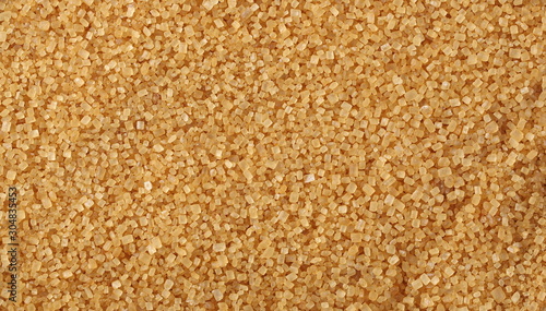 Brown cane sugar background and texture