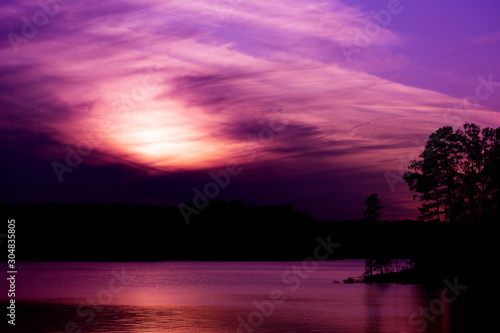 A colorfull twilight sky over a lake.