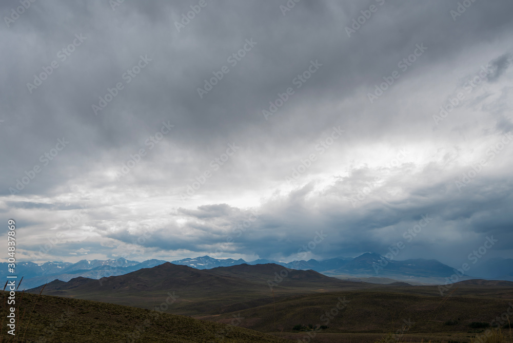 storm clouds over Sierra Nevada mountains and hills of California