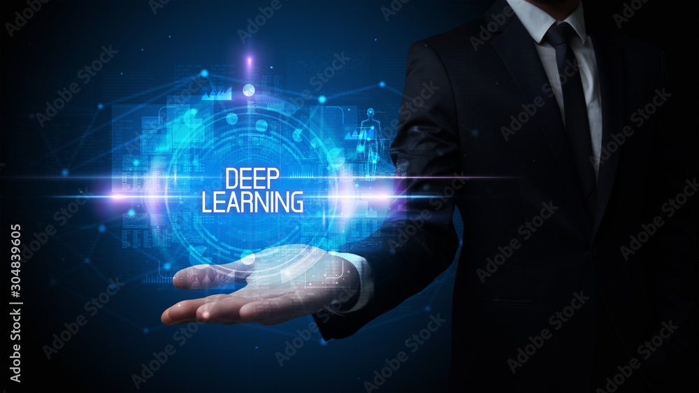 Man hand holding DEEP LEARNING inscription, technology concept Man hand holding DEEP LEARNING inscription, technology concept