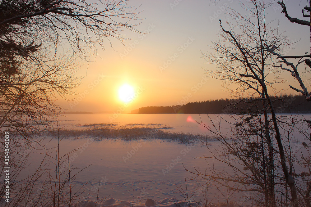 Sunset over a snowy lake