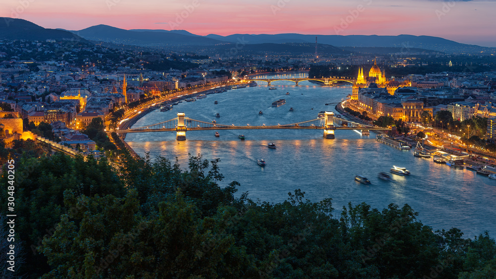 Sunset Budapest along Danube with Chain Bridge and Parliament Building