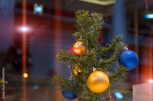 Christmas balls on the Christmas tree branch. Magic lights. Soft Selective focus