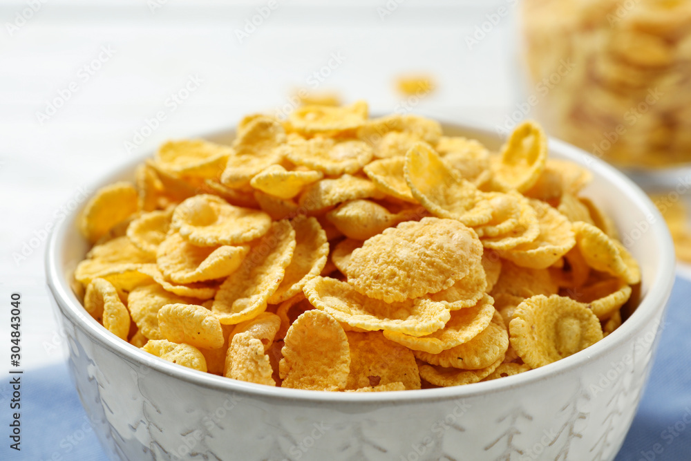 Tasty corn flakes on white table, closeup Tasty corn flakes on white table, closeup