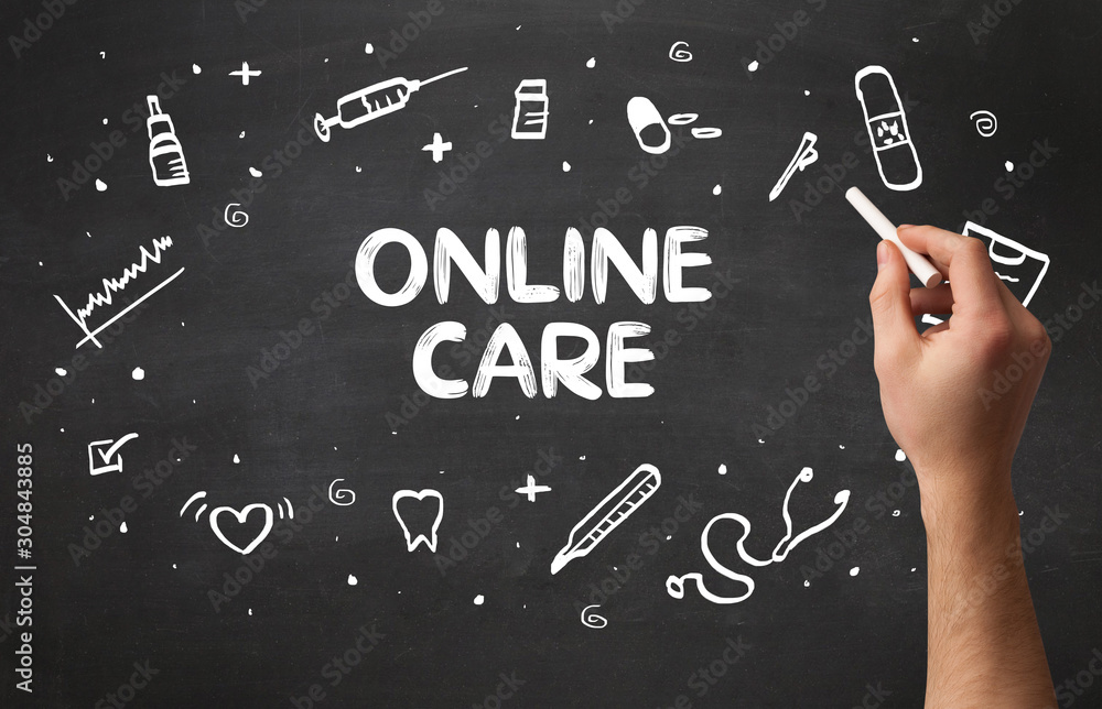 Hand drawing ONLINE CARE inscription with white chalk on blackboard, medical concept Hand drawing ONLINE CARE inscription with white chalk on blackboard, medical concept