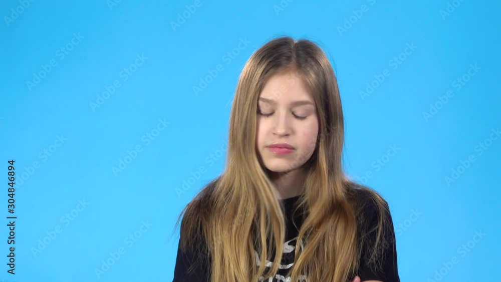 Girl looking unhappy, saying no, but then rejoicing, clapping hands. Girl looking unhappy, saying no, but then rejoicing, clapping hands.