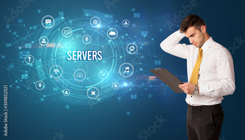 Businessman thinking in front of technology related icons and SERVERS inscription, modern technology concept