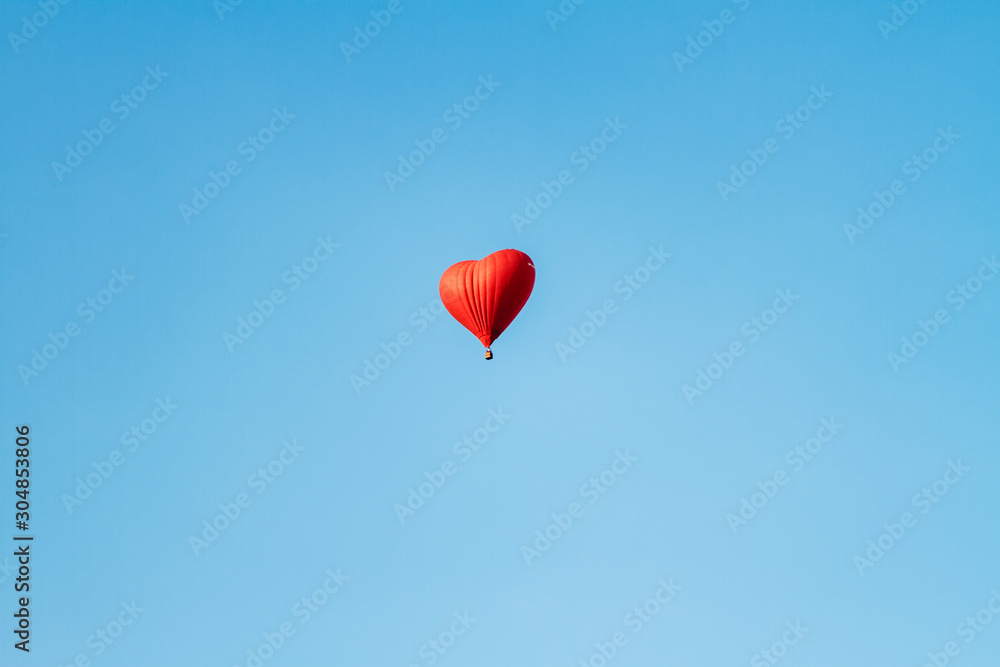 Heart shaped balloon soars in the sky Heart shaped balloon soars in the sky