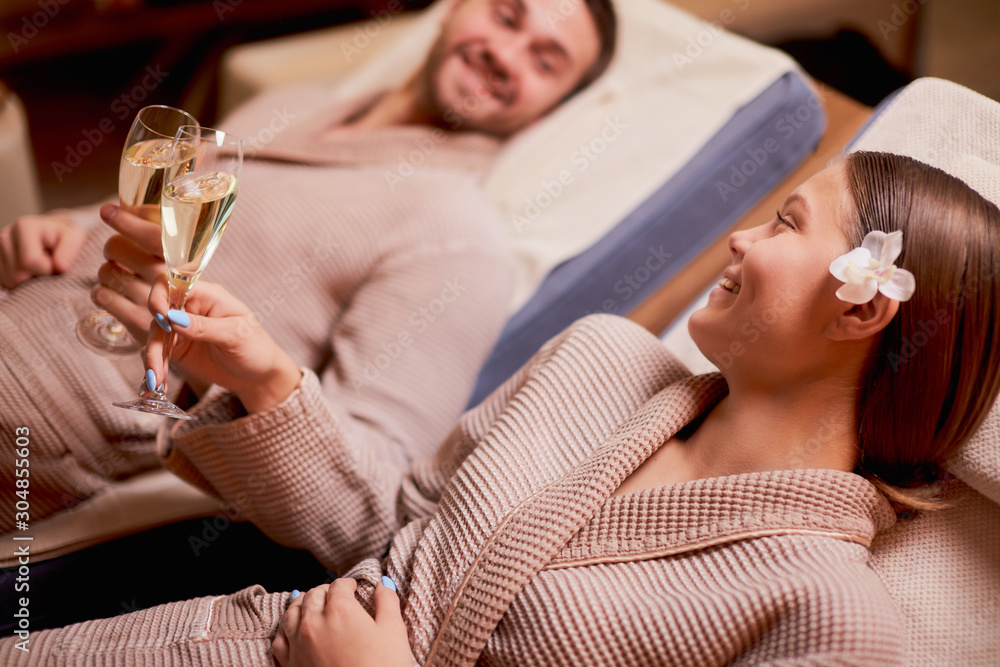© alfa27 - Beautiful caucasian couple in love relax spending time in spa center together, enjoy spa procedures, drinking champagne. isolated room © alfa27 - Beautiful caucasian couple in love relax spending time in spa center together, enjoy spa procedures, drinking champagne. isolated room