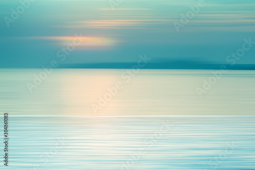 Motion blurred background of refraction in water © opasstudio
