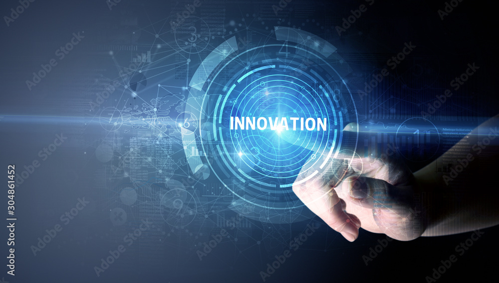 Hand touching INNOVATION button, modern business technology concept Hand touching INNOVATION button, modern business technology concept