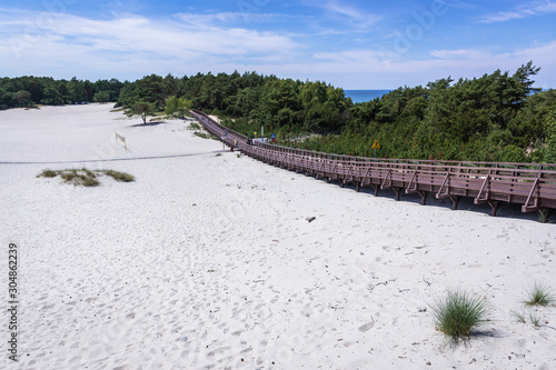 Obraz na płótnie Wooden path over dunes in Dzwirzyno, small village over Baltic Sea in West Pomer