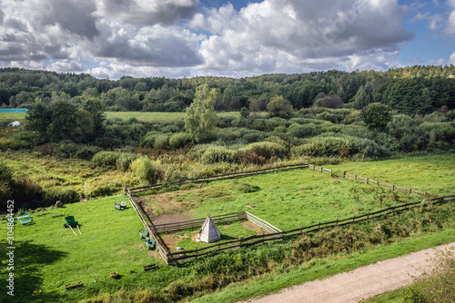 Fototapeta Naklejka Na Ścianę i Meble -  Rural landscape seen from antique railroad bridge in Glaznoty, small village in Masuria region of Poland