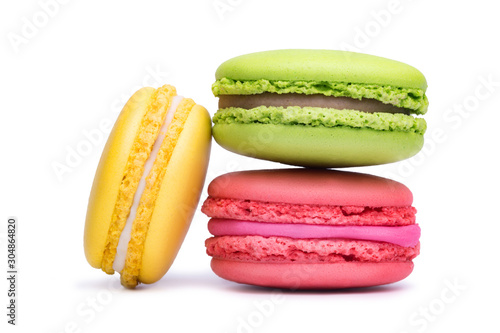 Obraz na plátně Yellow, pink and green macaron cookies isolated on white background