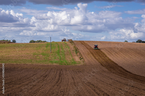 Fototapeta Naklejka Na Ścianę i Meble -  Plowed field on the border of Ostroda and Ilawa counties, Masuria region in Poland