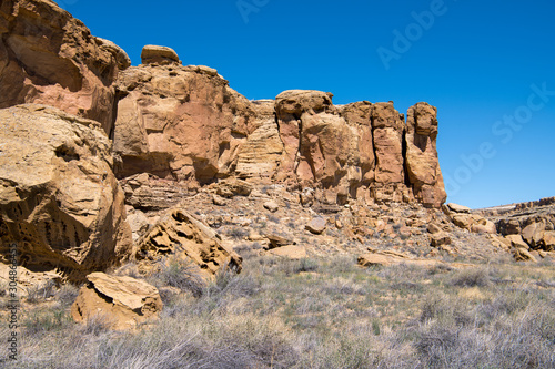 Colorful sandstone cliffs and boulders in Chaco Canyon, New Mexico, USA