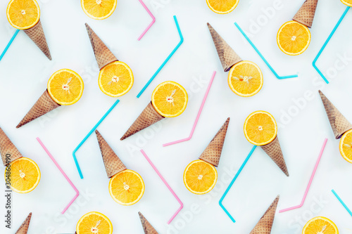 summer concept background with cone and juice oranges photo