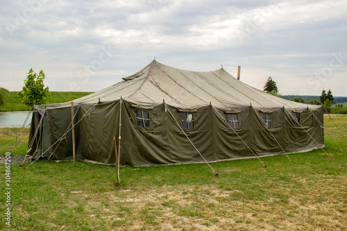 military tent in the the open countryside meadow