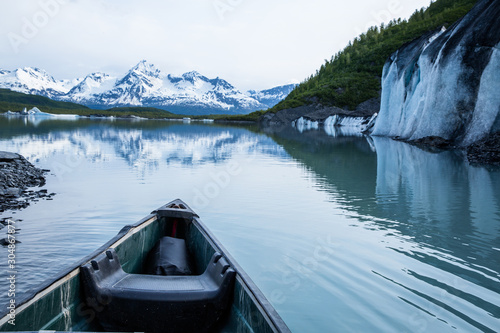 Canoe among icebergs in Valdez Glacier Lake, Alaska.
