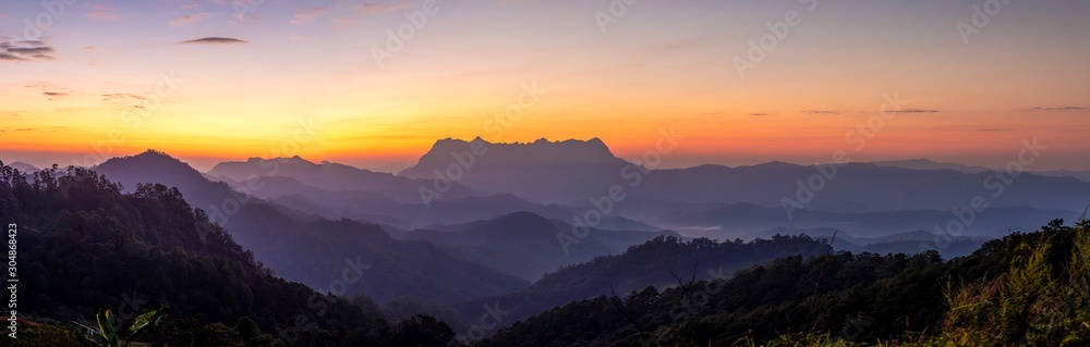 Panoramic mountain layers line at morning colorful sky background, landscape