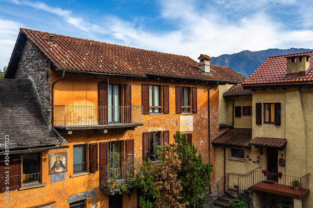 Typical colorful houses lined along a courtyard in Locarno historic center, Canton Ticino, Switzerland