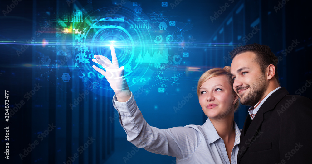 Man and woman touching hologram screen displaying medical symbols and charts Man and woman touching hologram screen displaying medical symbols and charts
