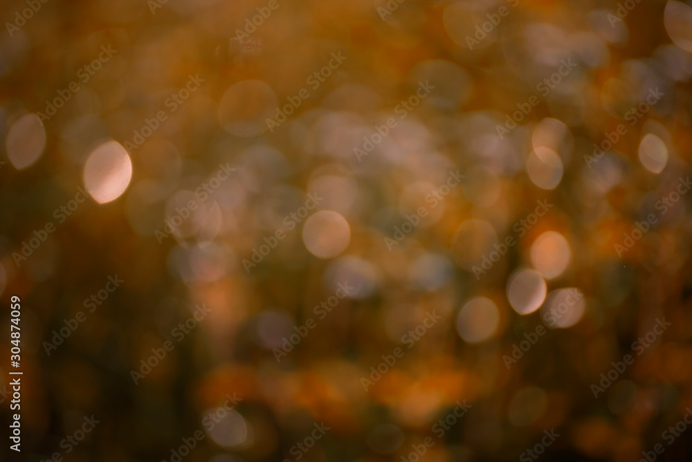 The abstract background of soft golden bokeh