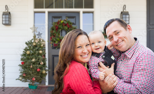 Happy Young Family On Front...