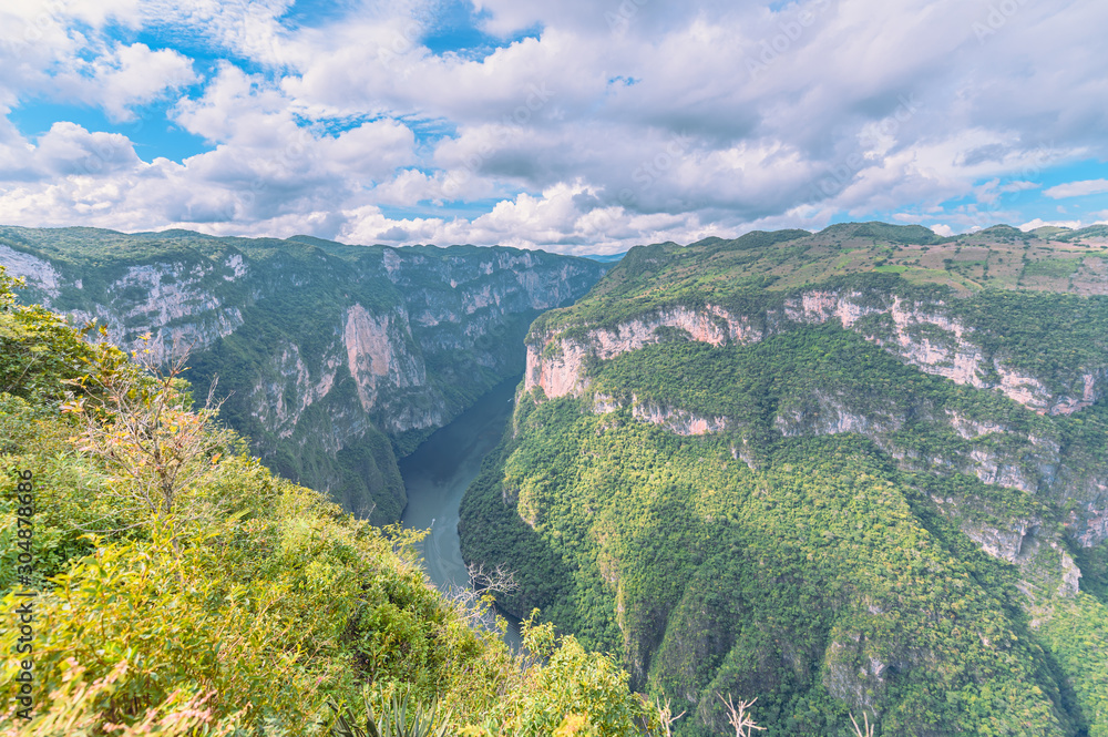 View of the heights of the Cañon Del Sumidero through which the river Grijalva crosses, in the background a clear sky