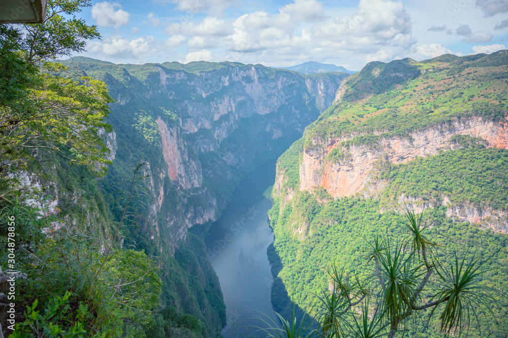 View of the heights of the Cañon Del Sumidero through which the river Grijalva crosses, in the background a clear sky.