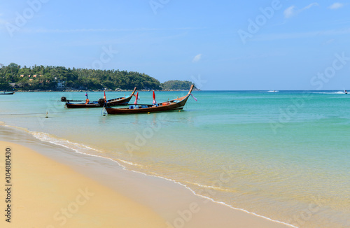 Long boat and tropical beach © opasstudio