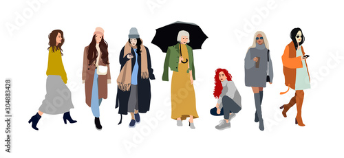 Foto Young women or girls dressed in trendy clothes standing together
