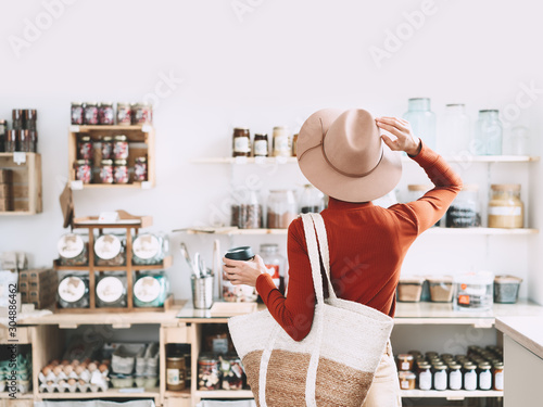 Young woman in zero waste shop. photo