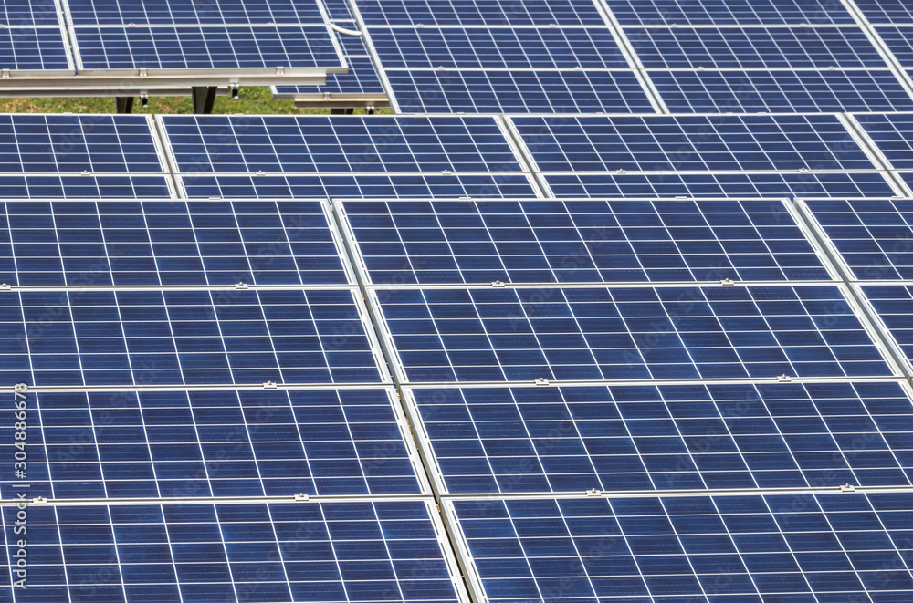 Close up rows array of polycrystalline silicon solar cells or photovoltaic cells in solar power plant turn up skyward absorb the sunlight from the sun Close up rows array of polycrystalline silicon solar cells or photovoltaic cells in solar power plant turn up skyward absorb the sunlight from the sun